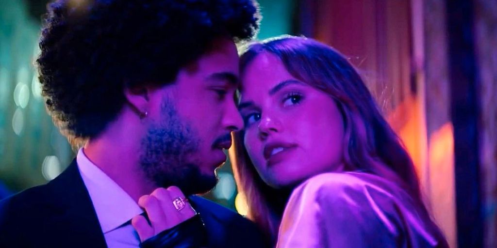 Blaire (Debbie Ryan) leaning in to kiss a surprised Benny (Jorge Lendenborg Jr.).