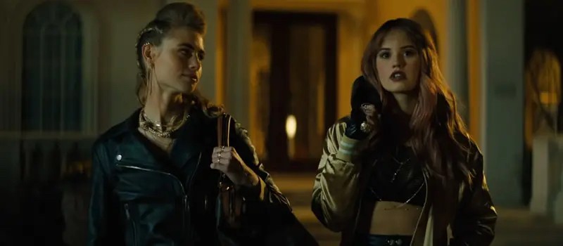 Zoe (Lucy Fry) and Blaire (Debby Ryan) walking together. 