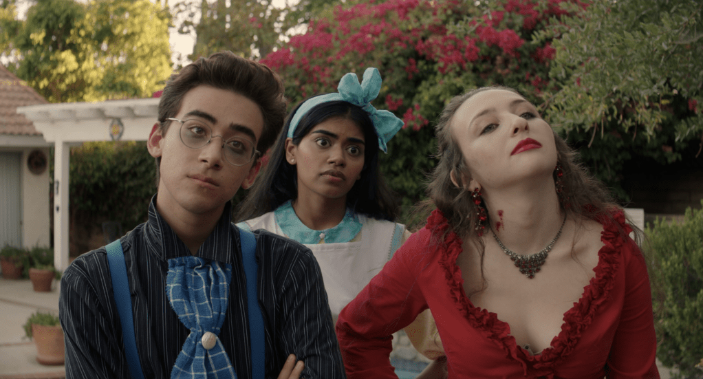 Gene (NIck Pugliese), Claire (Megan Suri) and Ally (Danielle Kay) looking critically at something.