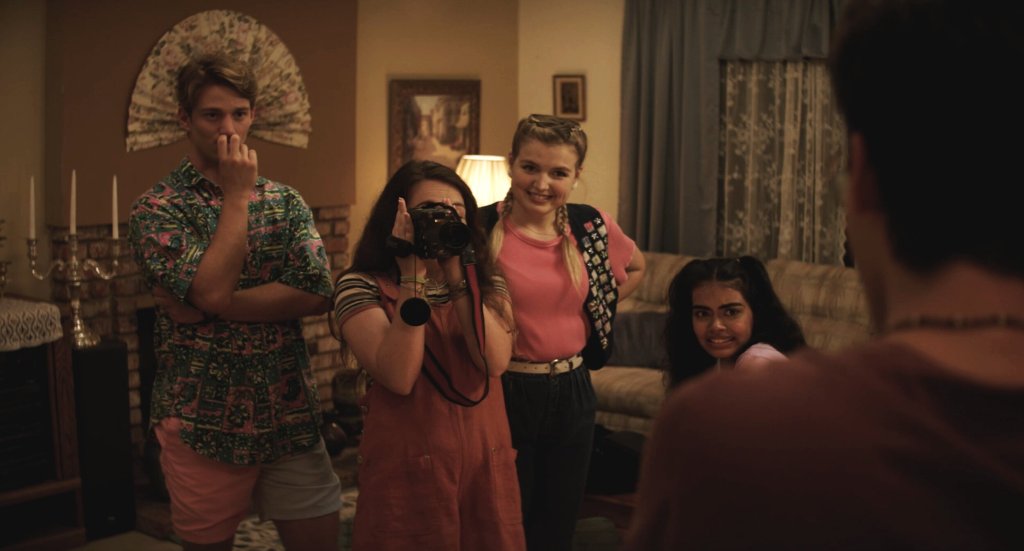 Ally (Danielle Kay) pointing the camera at Gene (Nick Pugliese) with Oscar (Nico Greetham), Rose (Anna Grace Barlow) and Claire (Megan Suri) behind her.