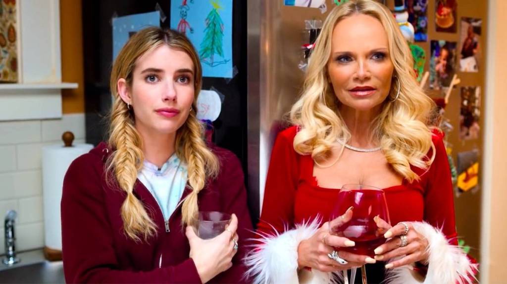 Sloane (Emma Roberts) and her aunt Susan (Kristin Chenoweth) at the family Christmas party.