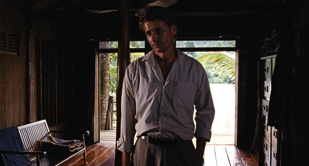 Almayer (Stanislas Merhar) standing in his house. 