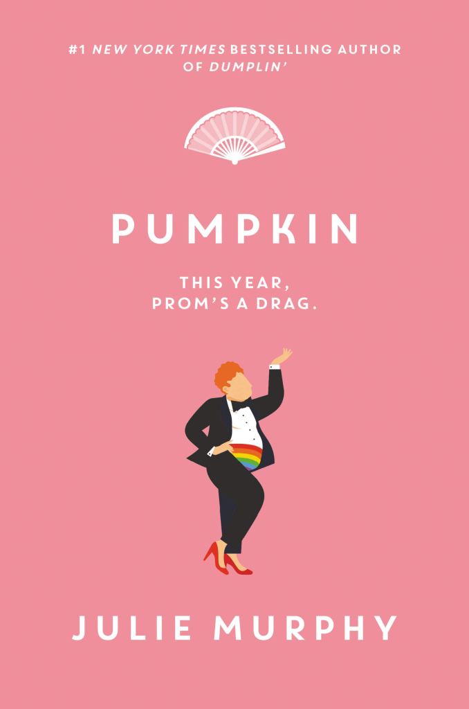 The pink book cover showing the graphic of a ginger fat boy wearing a suit, a rainbow kummerbund and red high-heels.