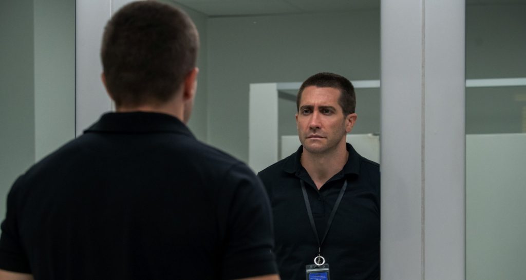 Joe Baylor (Jake Gyllenhaal) looking at himself in the bathroom mirror.