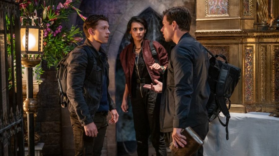 Nate (Tom Holland), Sully (Mark Wahlberg) and Chloe (Sophia Ali) debating how to proceed.