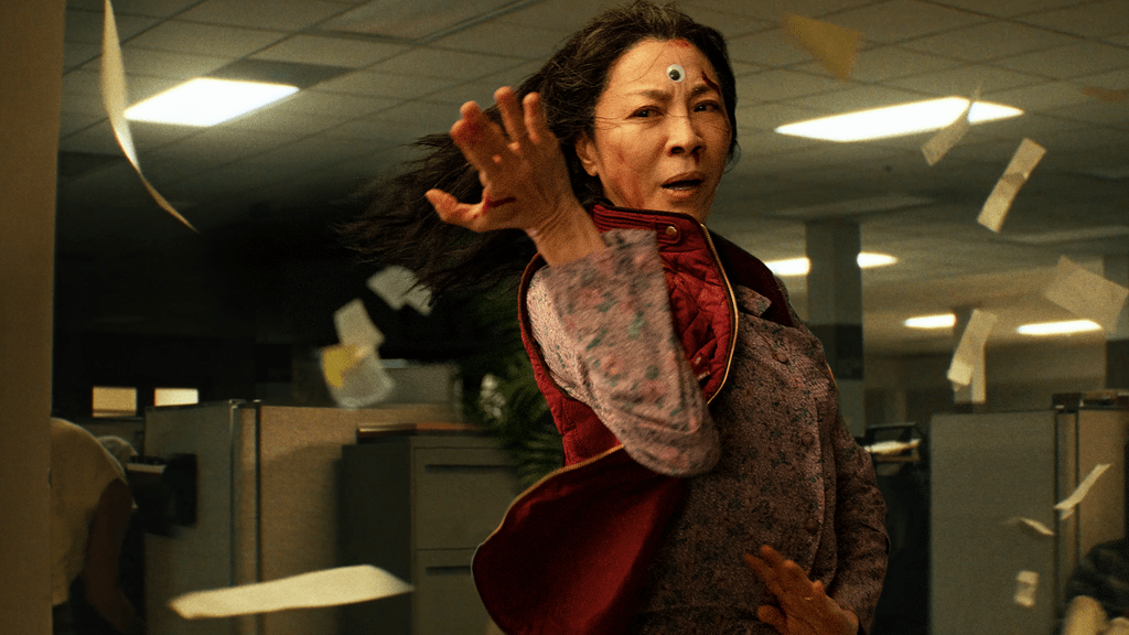 Evelyn (Michelle Yeoh) in a fighting pose, a single googly eye on her forehead.