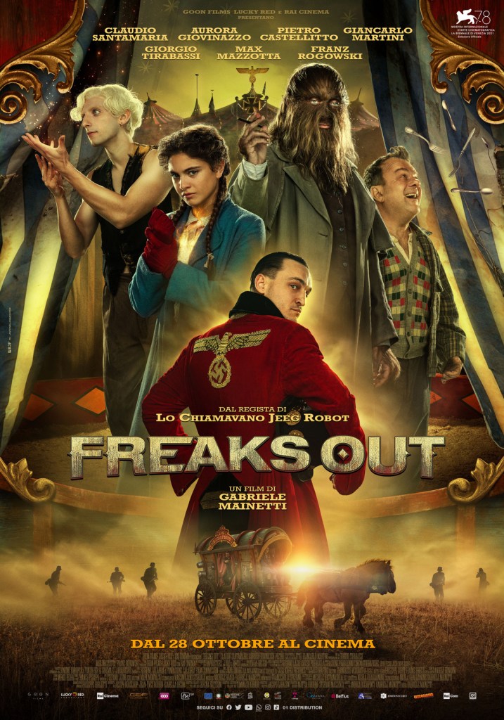 The film poster showing the four "freaks" in their performance poses, as well as Franz (Franz Rogowski) wearing a Nazi robe. 