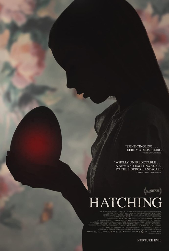 The film poster showing Tinja (Siiri Solalinna) in silhouette against a floral background. She is cradling a large egg that glows red.