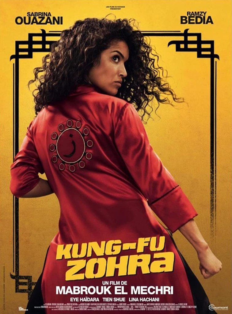 The film poster showing Zohra (Sabrina Ouazani) in a fighting pose wearing a red kimono-like shirt with an arab letter on the back.