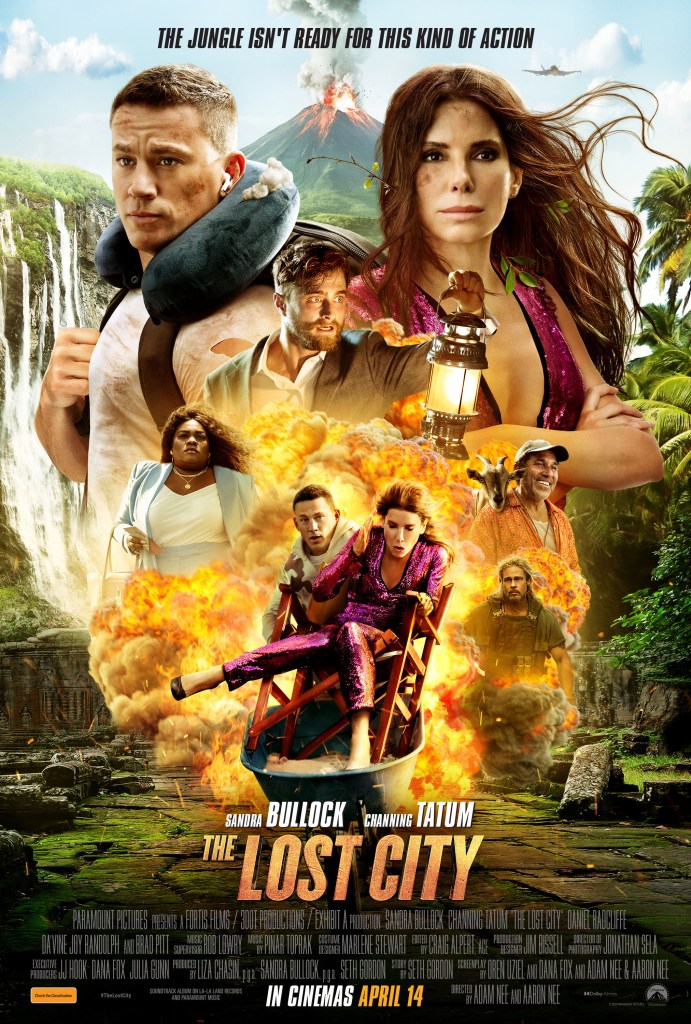 The film psoter showing the main characters of the film in a collage in front of a volcano and jungle and an explosion. 