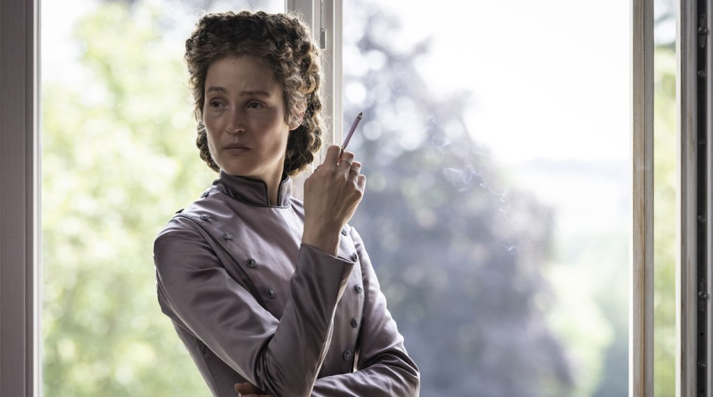 Elisabeth (Vicky Krieps) smoking at the window.