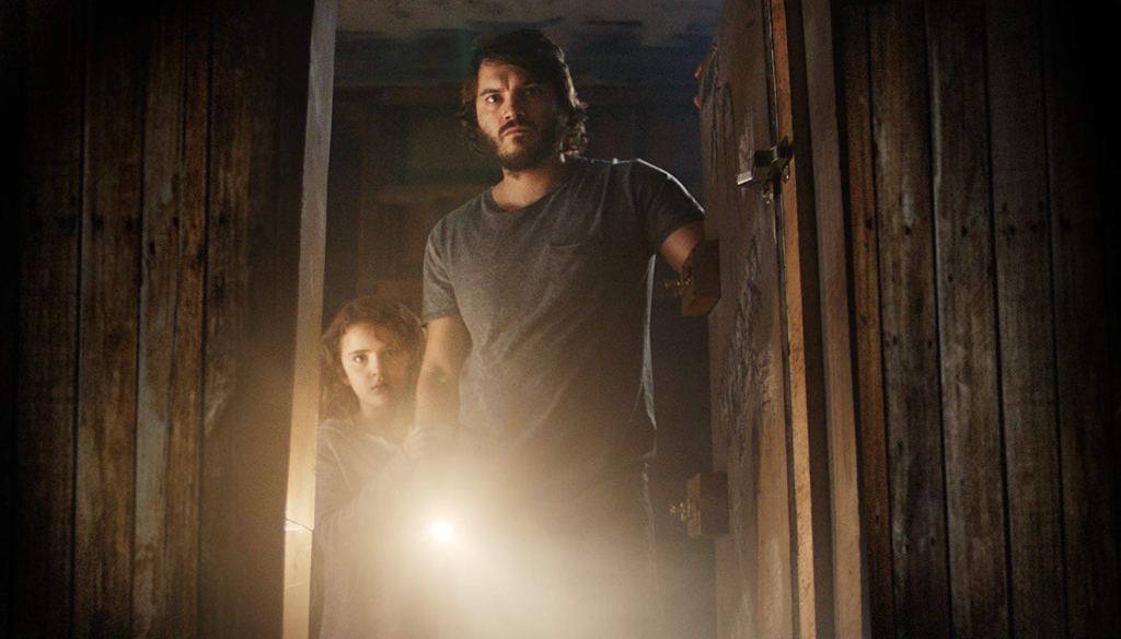Chloe (Lexy Kolker) and her dad (Emile Hirsch) looking into her closet with a flashlight.