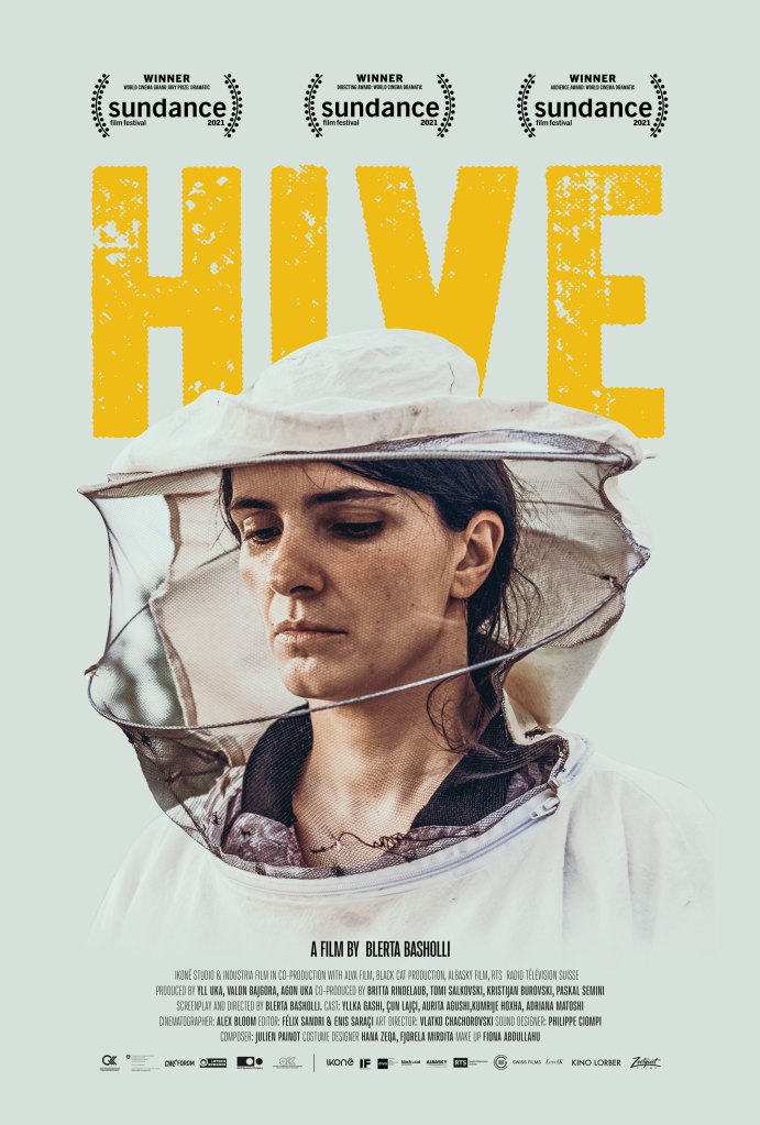 The film poster showing Fahrije (Yllka Gashi) wearing a beekeeper's hat. 
