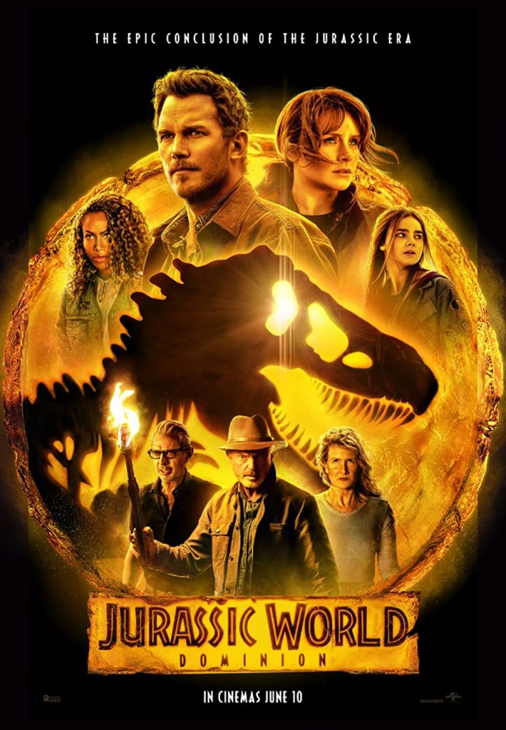 The film poster showing the central characters grouped around the iconic Jurassic Park logo: a dinosaur skull against an amber background. 