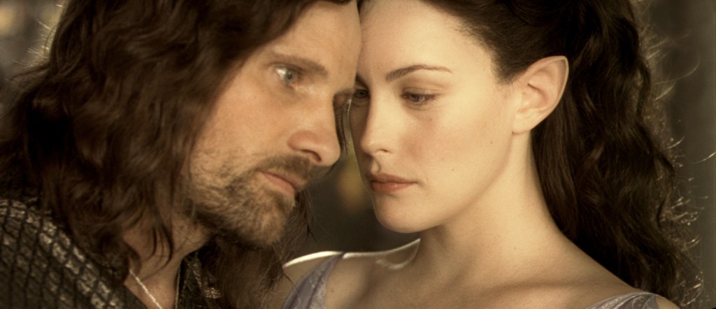 Aragorn (Viggo Mortensen) leaning against Arwen (Liv Tyler). 