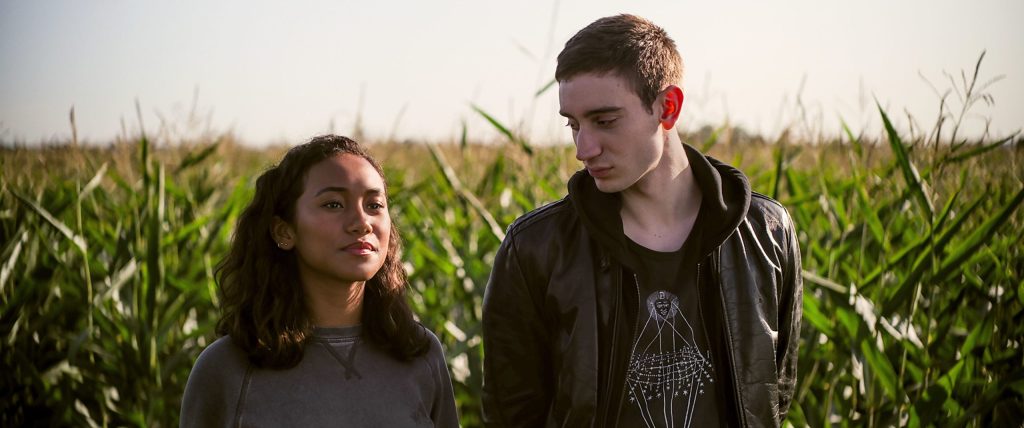 Makani (Sydney Park) and Ollie (Théodore Pellerin) walking through a cornfield.