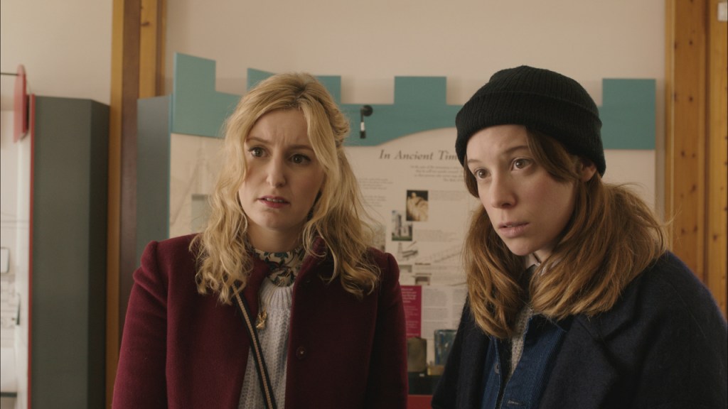 Seph (Laura Carmichael) and Alex (Chloe Pirrie) with shocked faces.