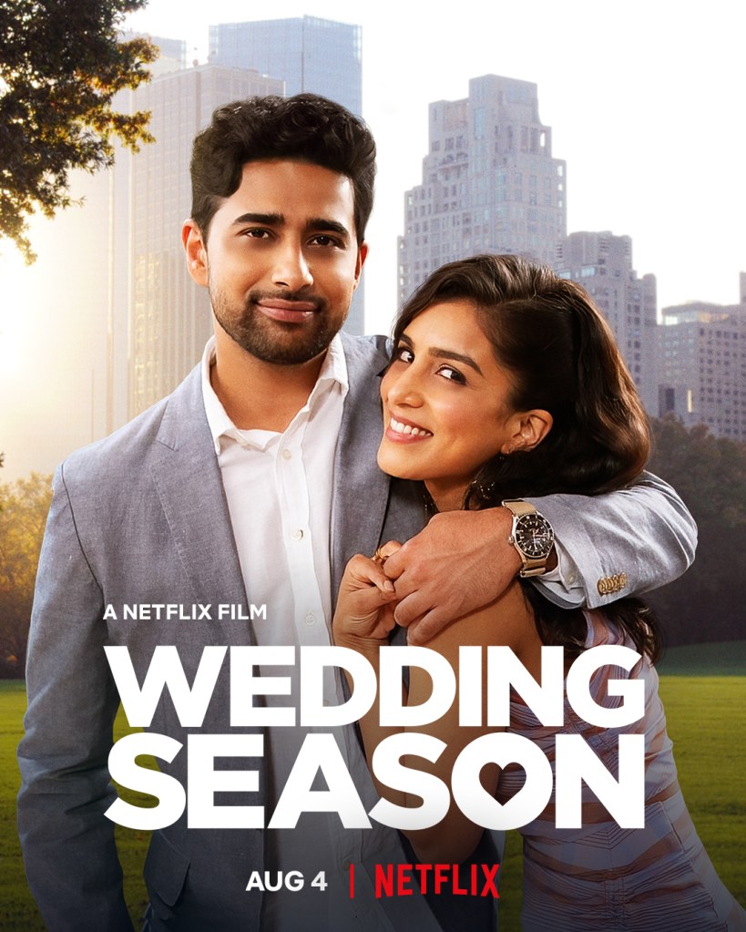 The film poster showing Ravi (Suraj Sharma) with his arm around Asha (Pallavi Sharda) in front of a city skyline.