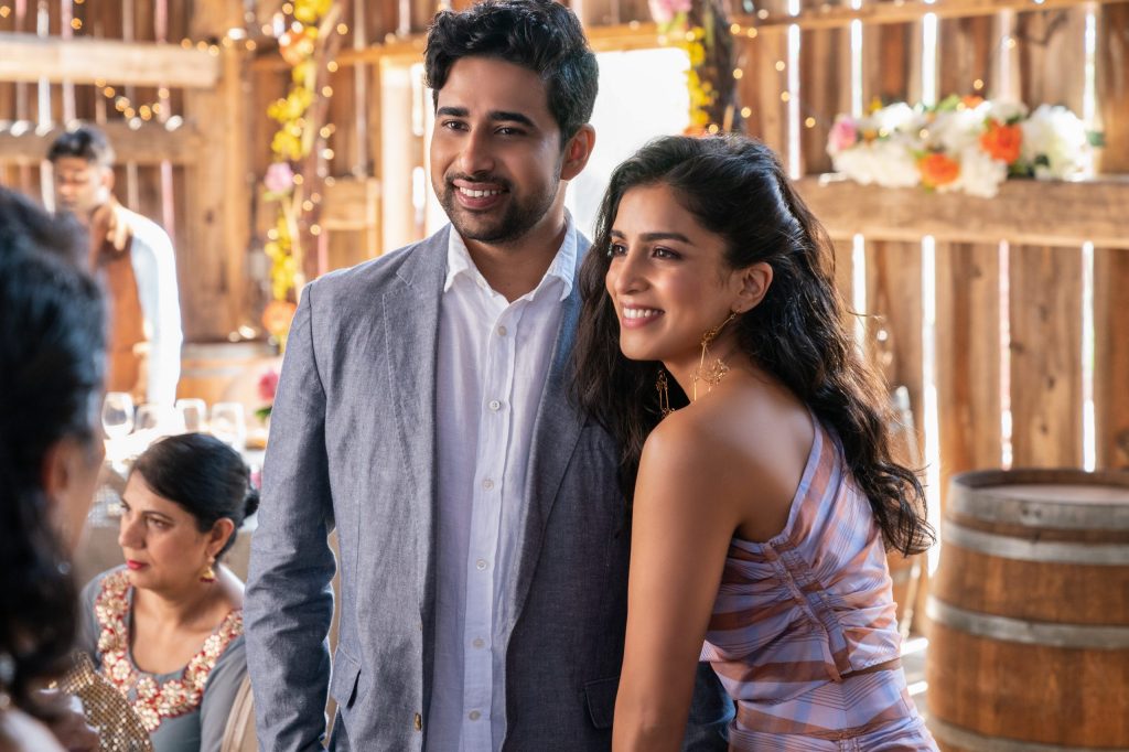 Ravi (Suraj Sharma) and Asha (Pallavi Sharda) attend a wedding together.