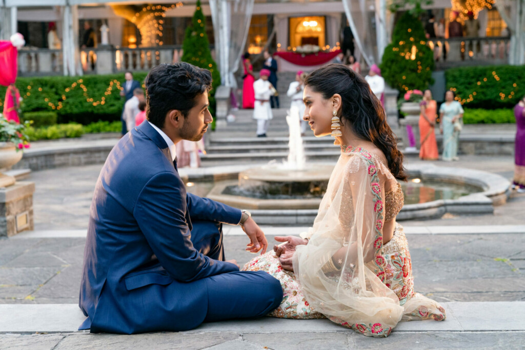 Ravi (Suraj Sharma) and Asha (Pallavi Sharda) have a heart to heart at another wedding.