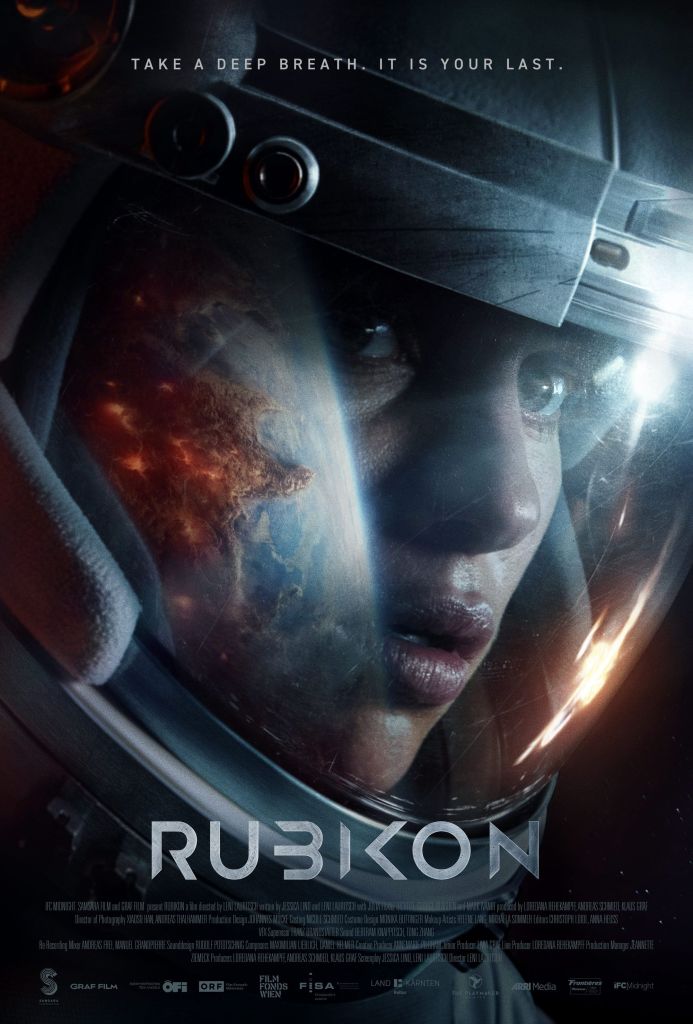 The film poster showing Hannah (Julia Franz Richter) wearing a space suit. The Earth is reflected in her visor, with a red fog covering a lot of it.