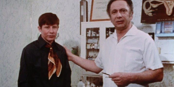 Dr Leo Wollman showing off a trans man.