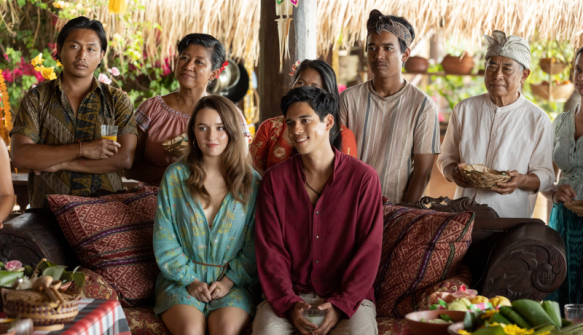 Lily (Kaitlyn Dever) and Gede (Maxime Bouttier) preparing for their wedding, surrounded by Gede's family.