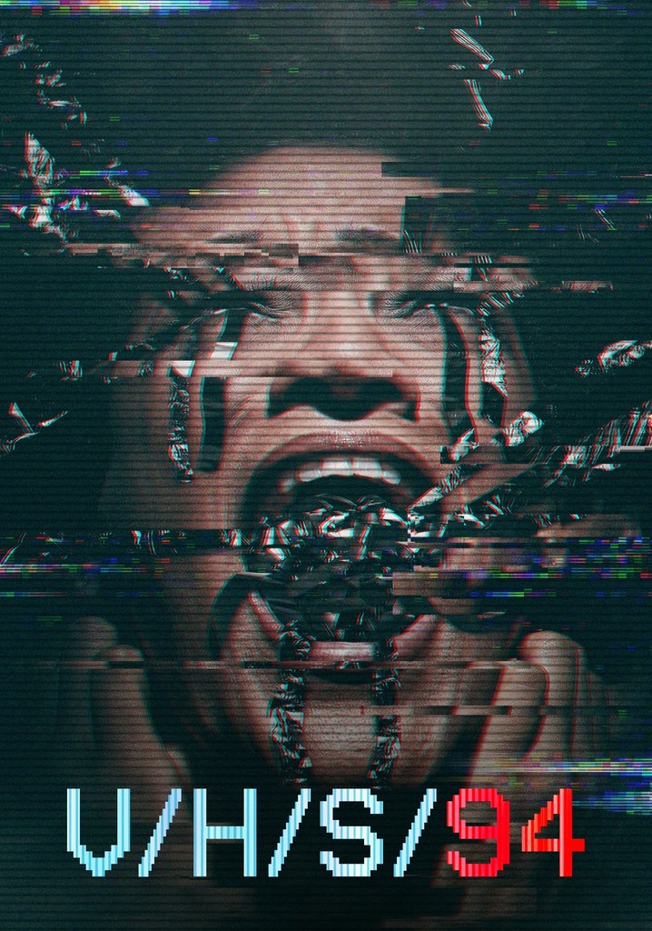 The film poster showing a face with something metallic coming out of its mouth. The image is distorted, as if taken from an old VHS tape.