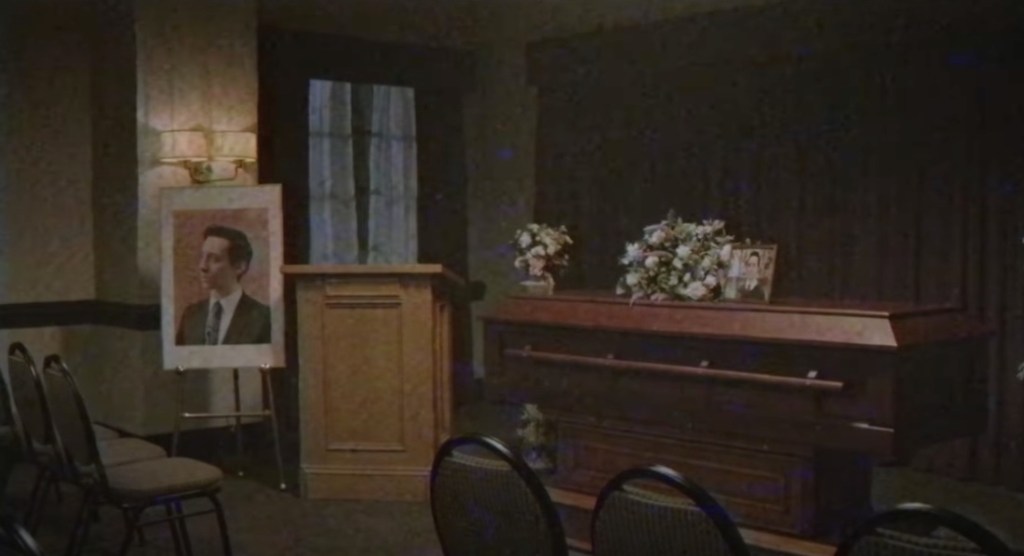 A coffin in a funeral home.