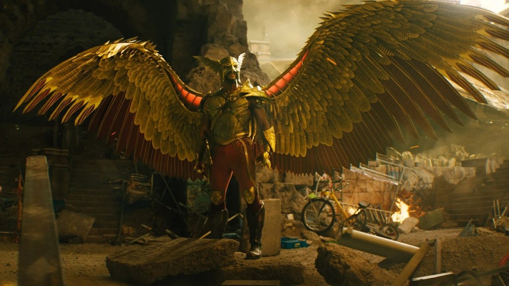 Hawkman (Aldis Hodge) standing in the rubble, his wings spread.