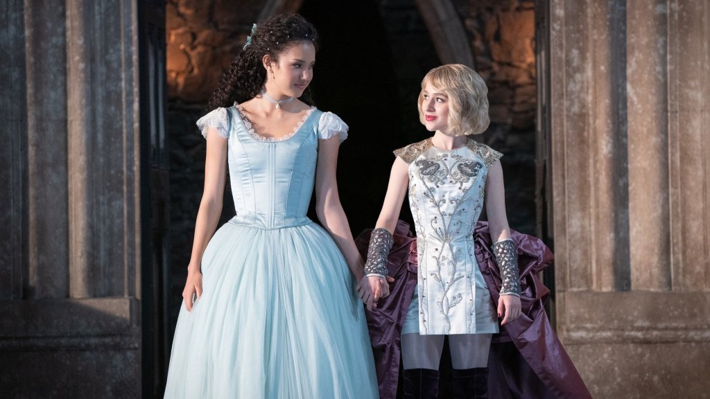 Agatha (Sofia Wylie) and Sophie (Sophia Anne Caruso) walking together, holding hands.