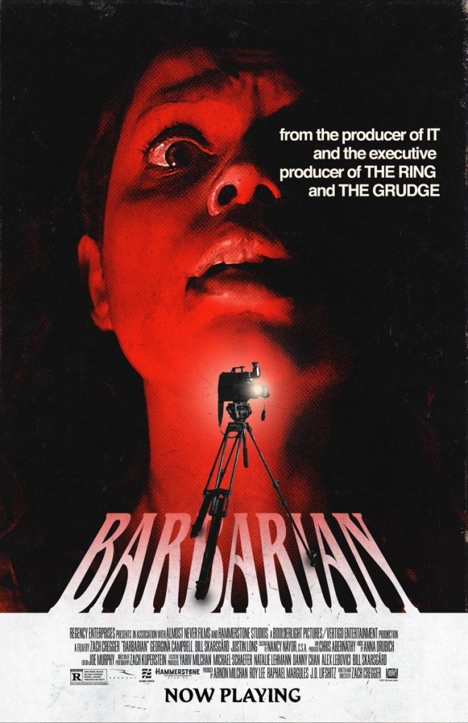 The film poster showing a close-up of Tess (Georgina Campbell) looking scared. Below her chin is a camera. 