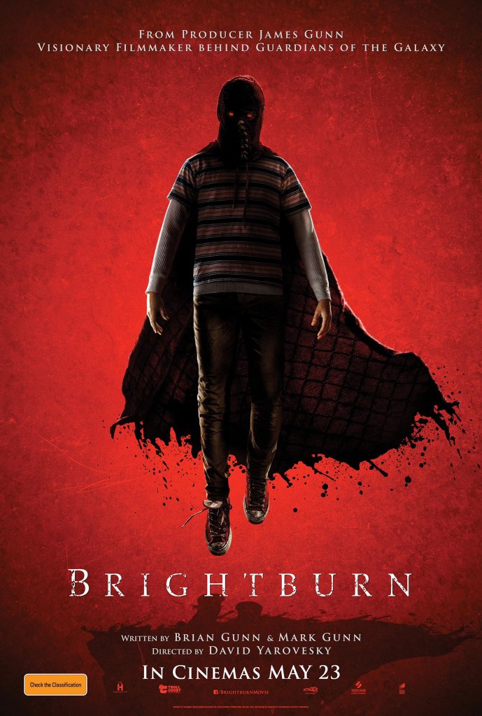 The film poster showing Brandon (Jackson A. Dunn) floating. He is wearing a creepy red mask and a red cape.