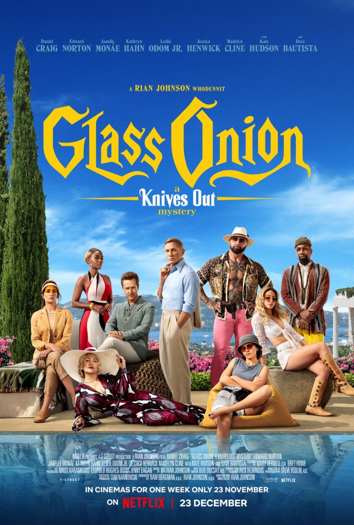 The film poster showing the entire group sitting and standing next to the pool, Benoit Blanc (Daniel Craig) in the center.