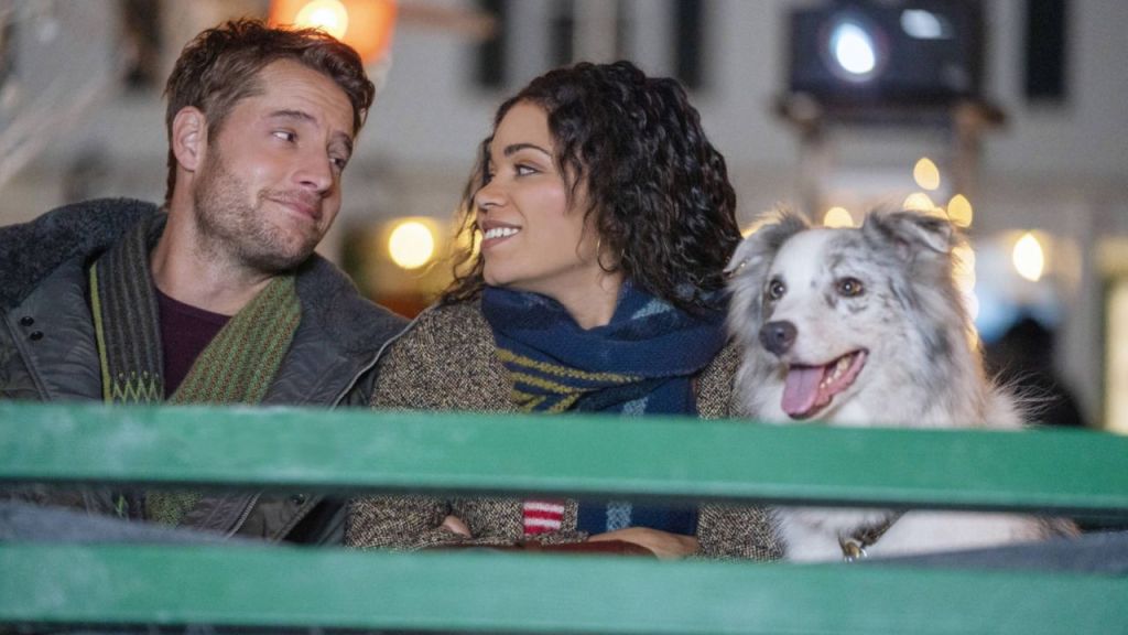 Rachel (Barrett Doss) and Jake (Justin Hartley) sitting closely together.