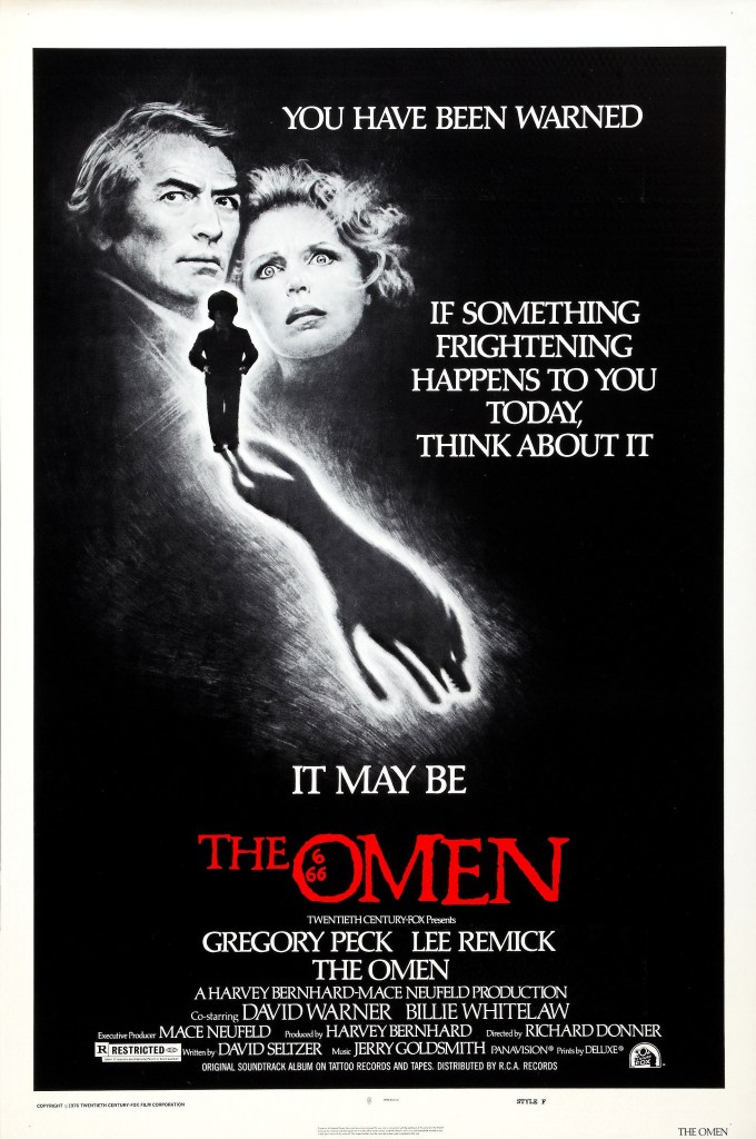 The film poster, showing a drawing of Robert (Gregory Peck) and Katherine (Lee Remick) standing close together, looking scared. Underneath them is the silhouette of Damien (Harvey Stephens) who throws a shadow in the shape of a wolf.