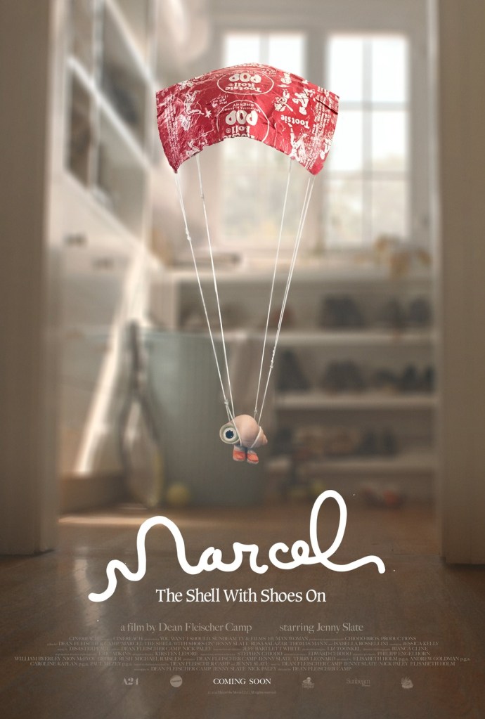 The film poster showing Marcel, a shell with one eye and orange sneakers, hanging in a parachute made from a tootsie roll wrapper.