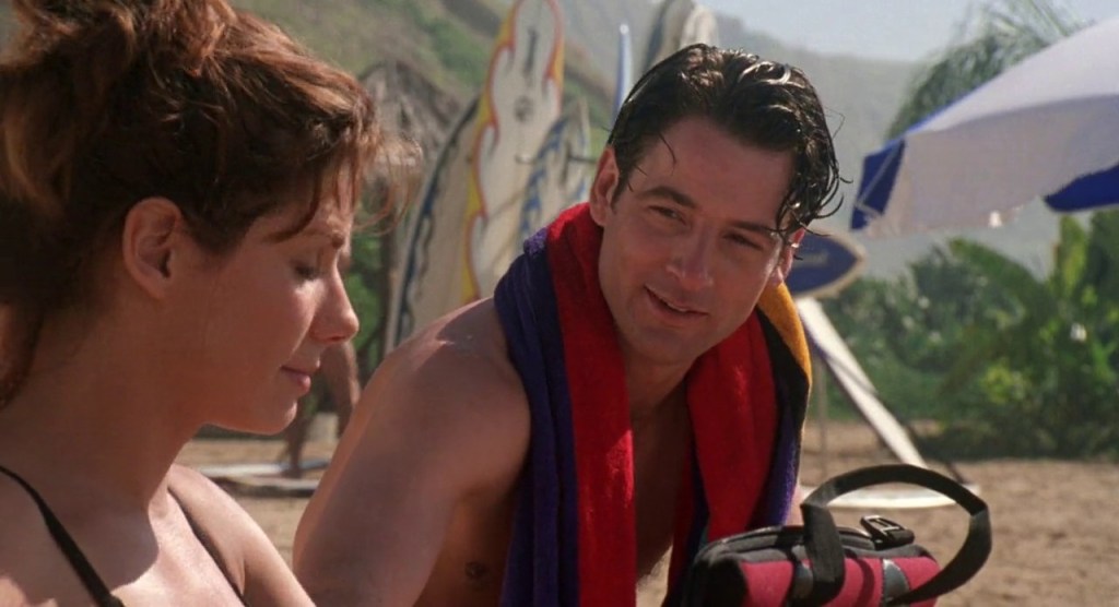 Angela (Sandra Bullock) meets jack (Jeremy Northam) on the beach. 