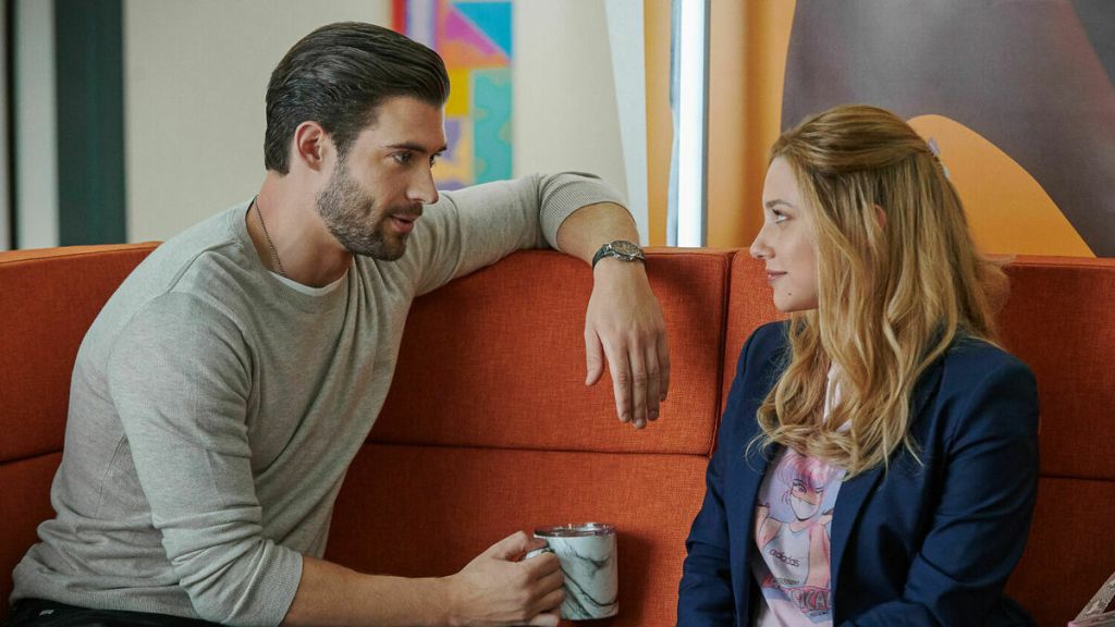 Jake (David Corenswet) and Natalie (Lili Reinhart) looking at each other.