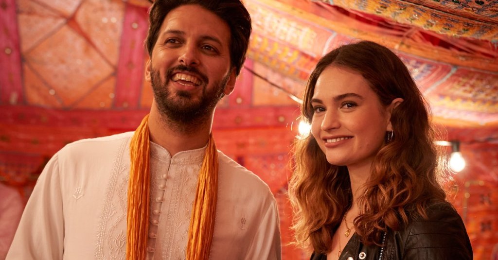 Kazim (Shazad Latif) and Zoe (Lily James) at wedding festivities.