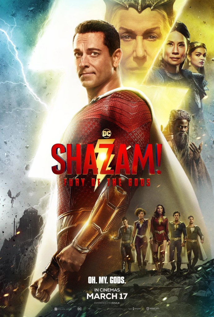 The film poster showing Billy as superhero Shazam (Zachary Levi). Behind him are the faces of Hespera (Helen Mirren), Kalypso (Lucy Liu) and Anthea (Rachel Zegler), as well as the Wizard (Djimon Hounsou). Below them an dmuch smaller are the other kids in superhero form.