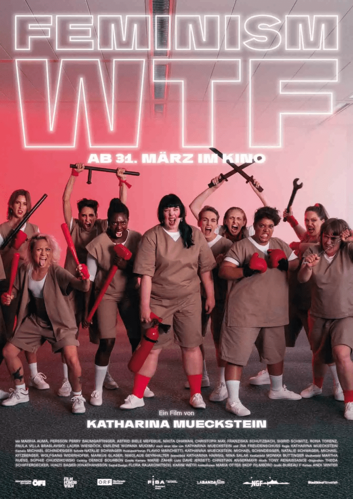 The film poster showing a group of women of various races all dressed in brown shorts and shirts with white undershirts. They all carry various weapons in black and red and are screaming.