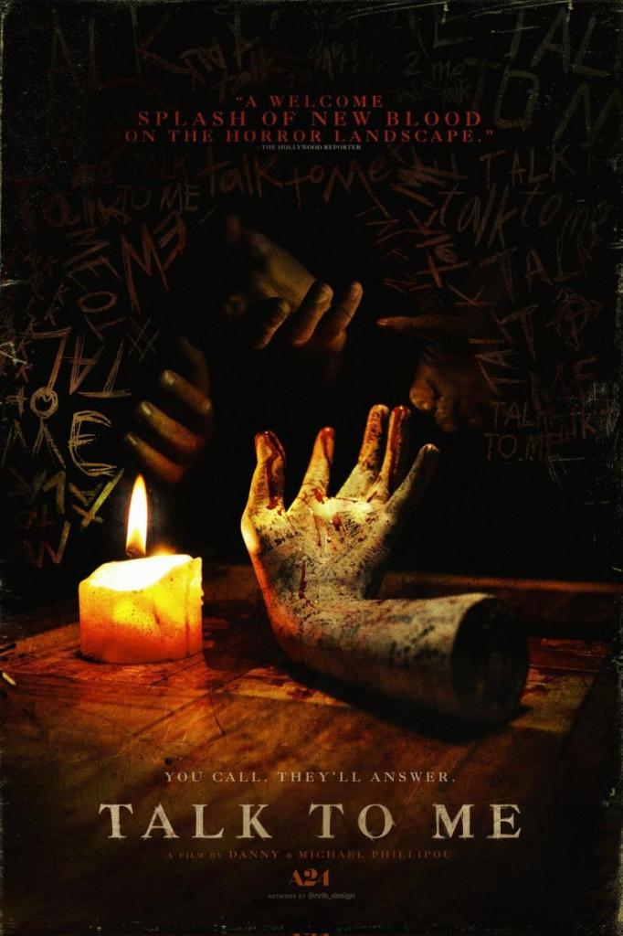 The film poster showing a candle and a ceramic hand with blood on it.