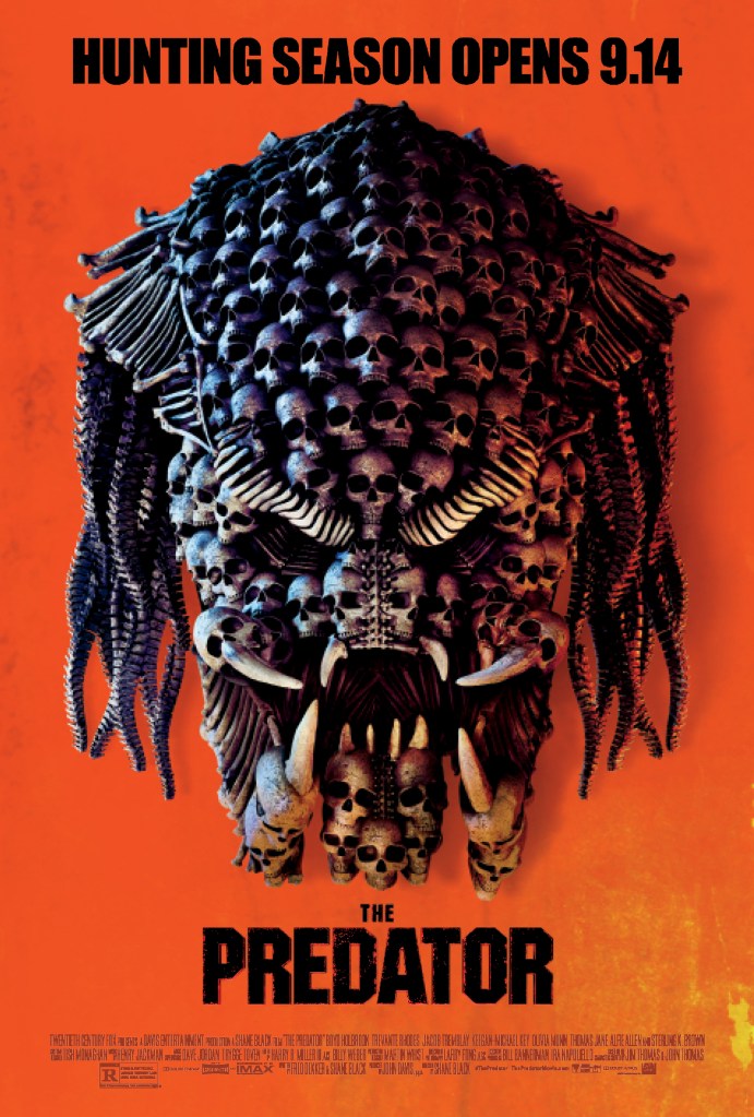 The film poster showing a predator head made up of human skulls and bones. 