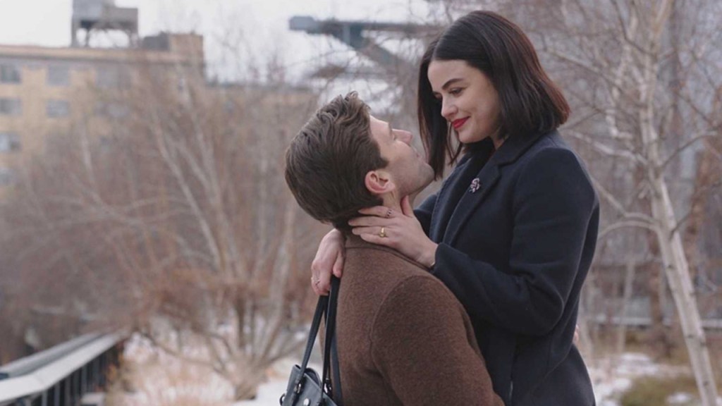 Joshua (Austin Stowell) holding Lucy (Lucy Hale) up so she is smiling down at him.