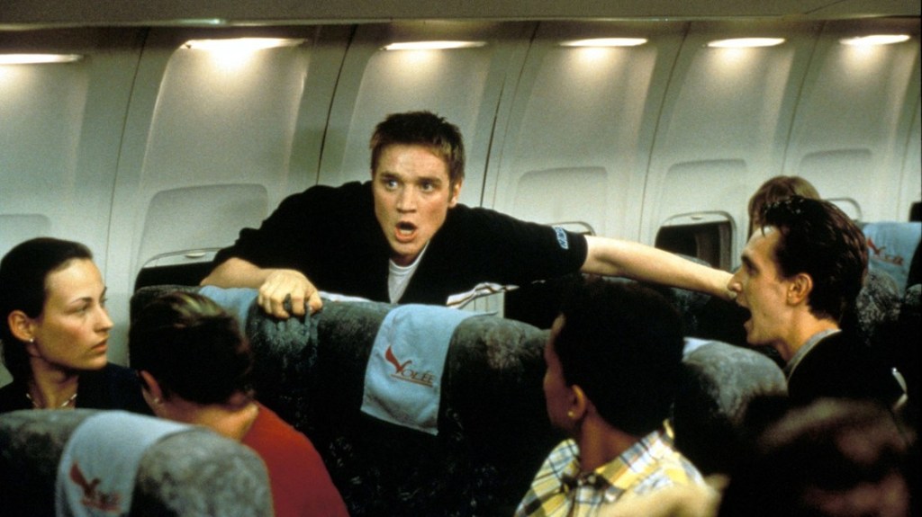 Alex (Devon Sawa) having a panic attack on the plane.
