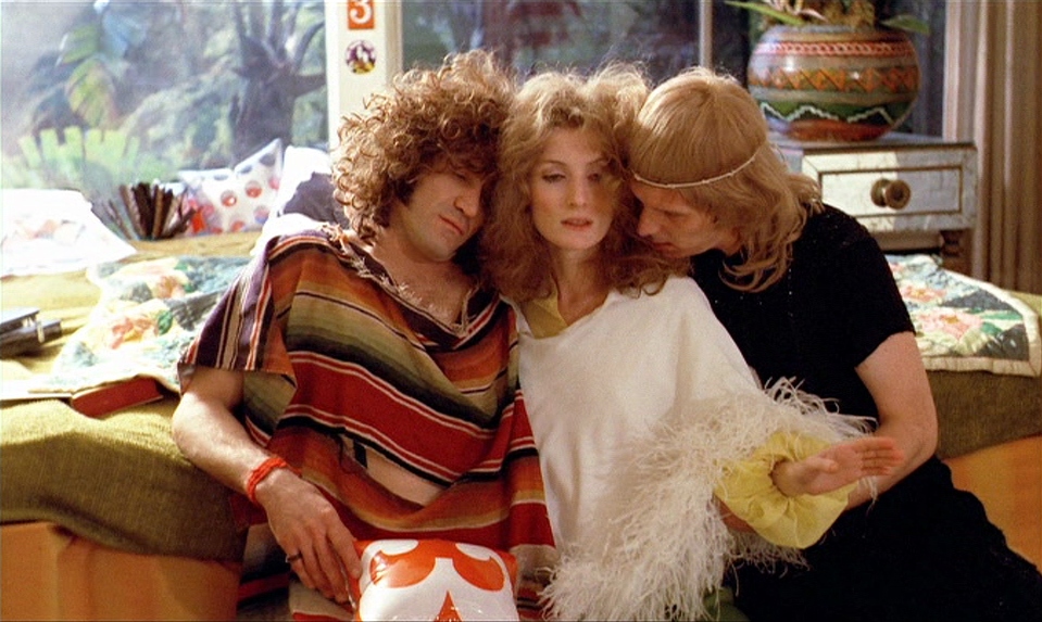 Viva (Viva), Jim (James Rado) and Jerry (Gerome Ragni) cuddling on the bed.