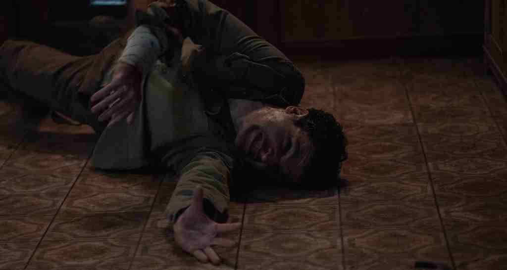 Blake (Christopher Abbott) writhing on the floor.
