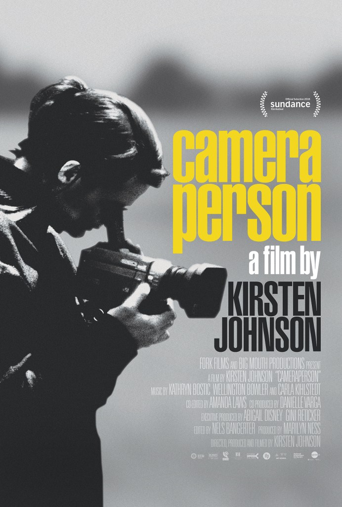 The film poster showing a black and white image of Kirsten Johnson looking into a portable movie camera.