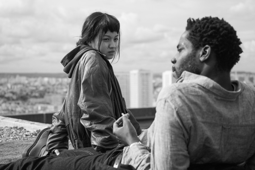  Émilie (Lucie Zhang) and Camille (Makita Samba) sitting on a rooftop together.
